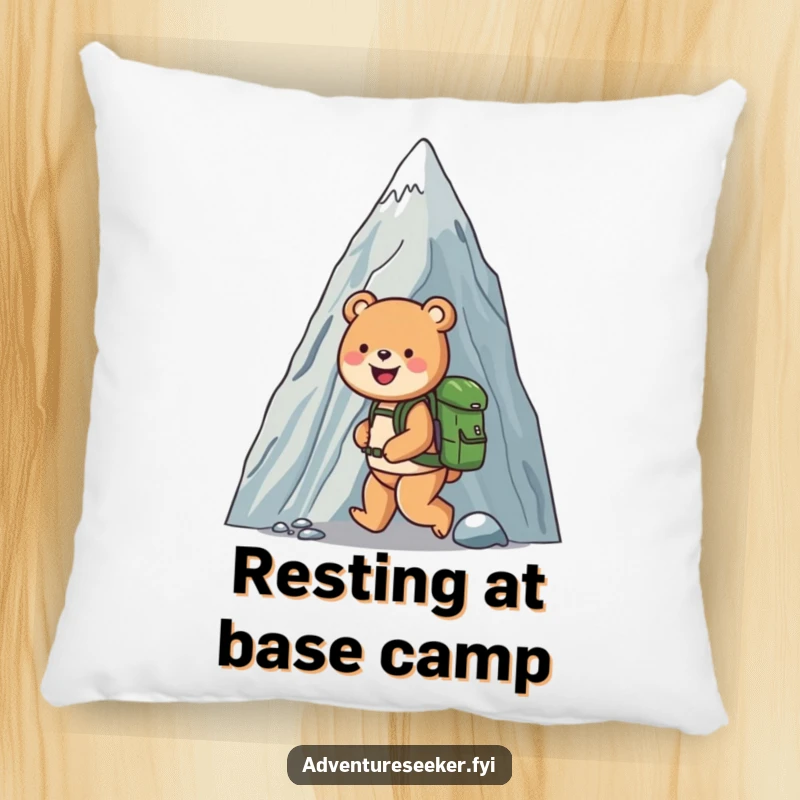 Funny pillow showcasing a happy bear equipped with a backpack, joyfully ascending a colossal mountain, offering soft comfort and humor.