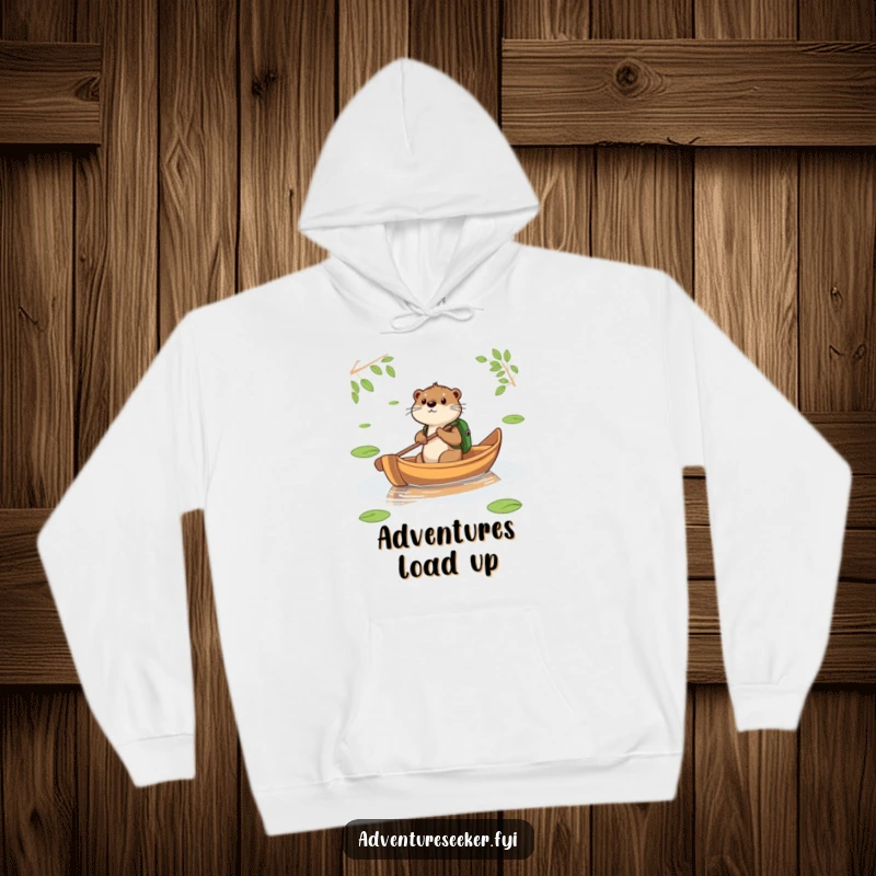 Funny Otter Leaf Boat Hoodie. A determined otter paddles a leaf boat, offering warmth and travel-ready humor.