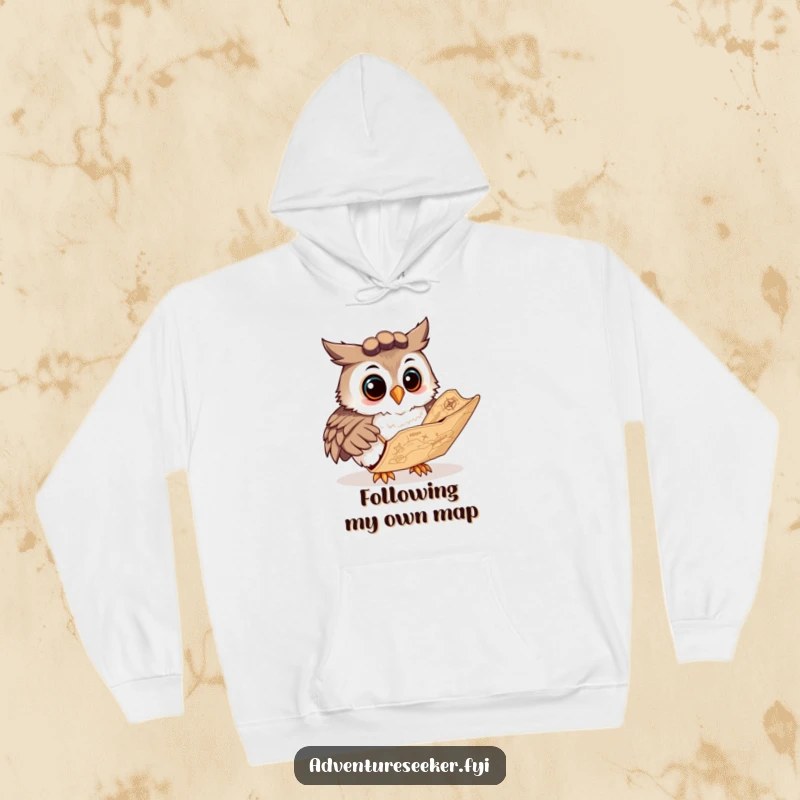 Funny hoodie featuring a curious owl navigator character studying an ancient map, offering warmth and a humorous, wise design.