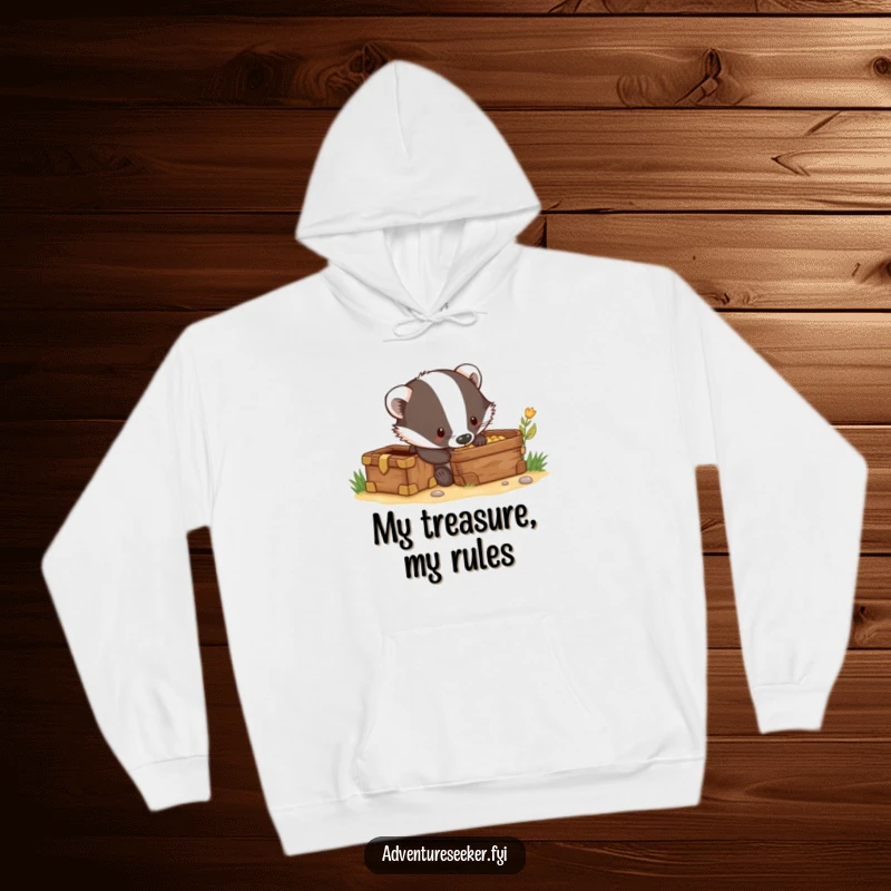 Funny hoodie showing a curious badger character digging enthusiastically next to a hidden treasure chest, ready to find gold.
