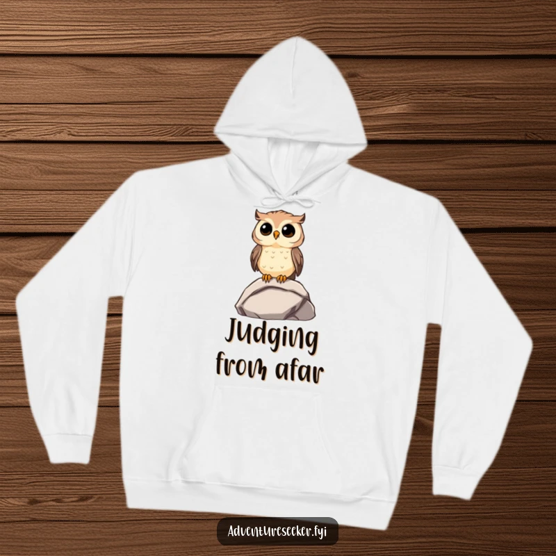 Funny Owl Hoodie: Curious owl perched on a rock, gazing far away, embodying funny contemplation.