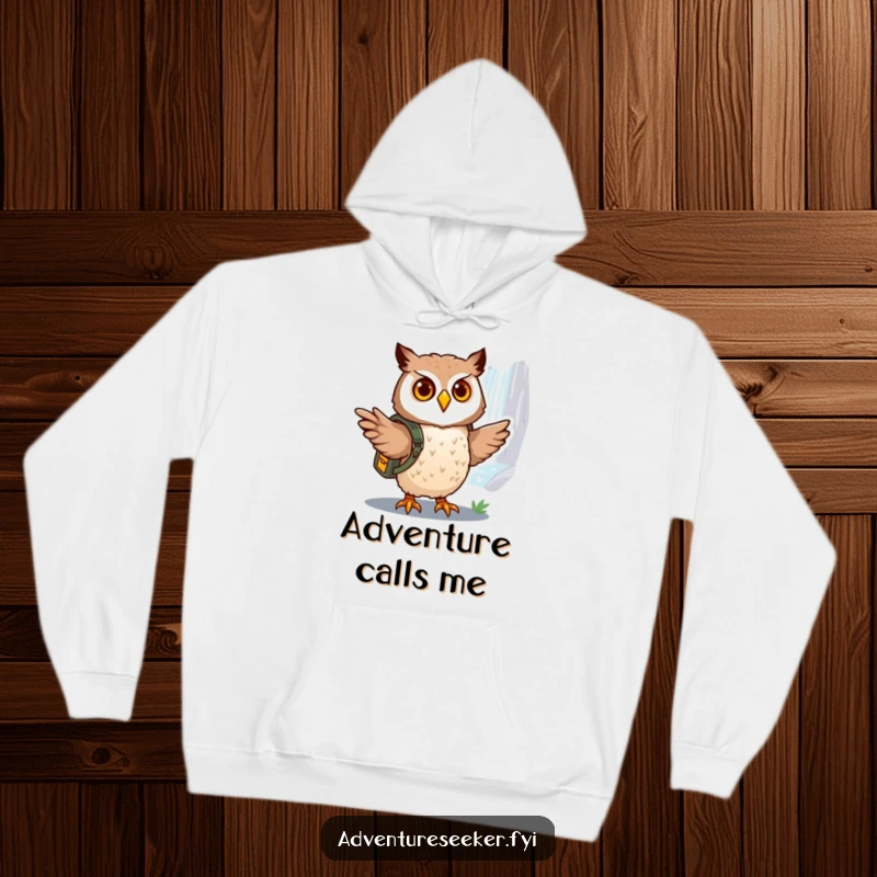 Funny owl explorer hoodie, showing a brave owl with a miniature backpack pointing towards a distant, shimmering waterfall.