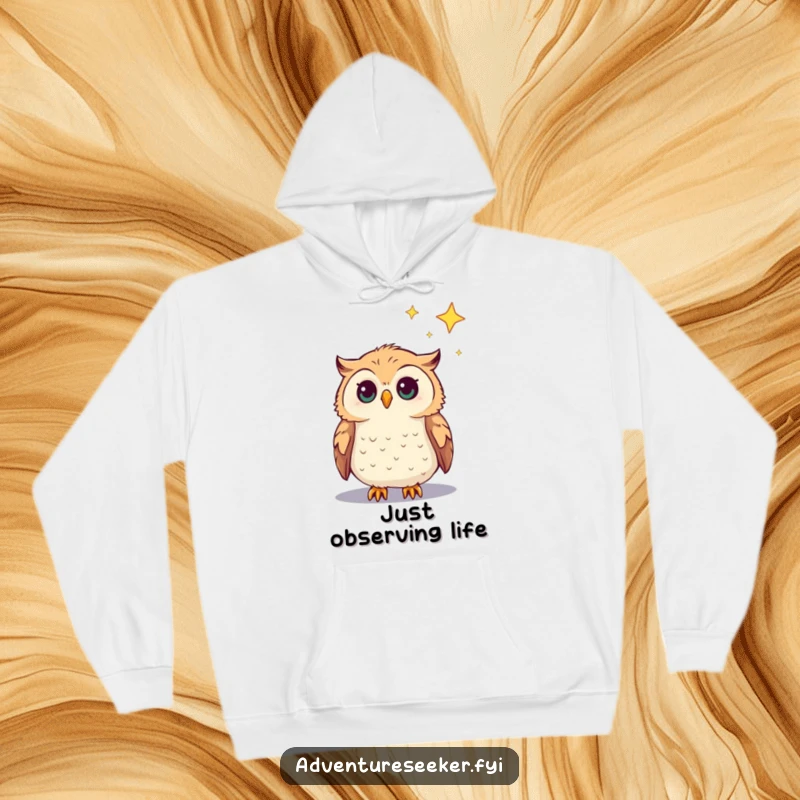 Funny Owl Hoodie depicting a curious owl character gazing at a distant star, perfect cozy and humorous gift.