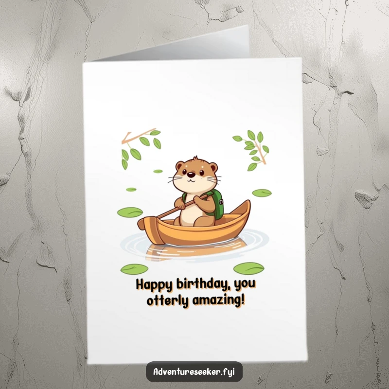 Funny Free Printable Birthday Card: Otter with backpack paddles a leaf boat across a pond, determined journey.