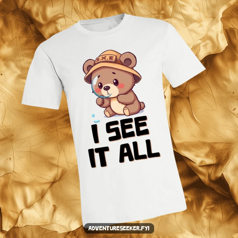 Funny bear cub explorer t-shirt, wearing explorer hat and holding magnifying glass, discovering a dewdrop with intense focus.