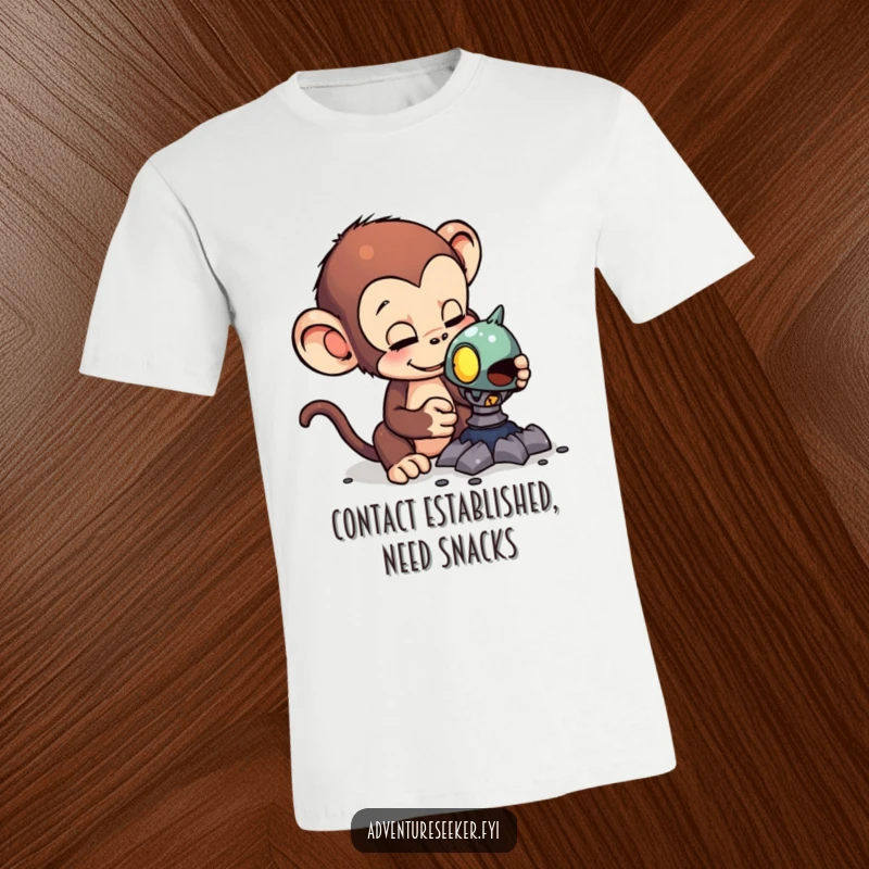 Funny t-shirt depicting a curious monkey examining an odd alien artifact, highlighting a moment of humorous scientific inquiry.