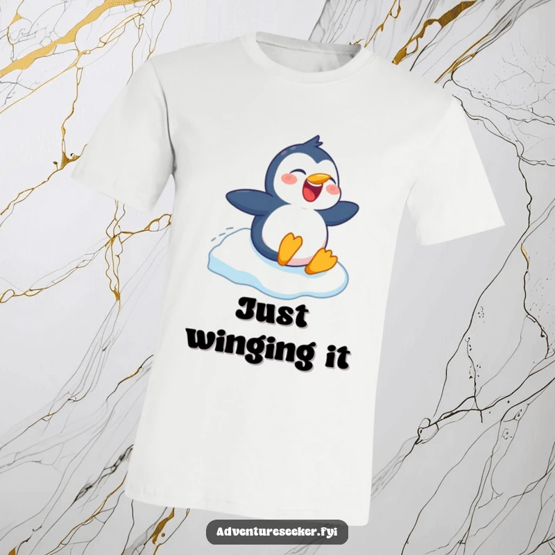 Funny t-shirt depicting a beaming penguin character joyfully sliding down a snowy mountain, perfect for winter lovers, a funny gift.