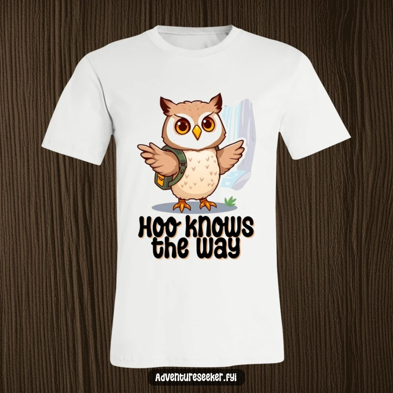 Funny owl explorer t-shirt, a brave owl with a backpack pointing towards a distant, shimmering waterfall, indicating a journey.