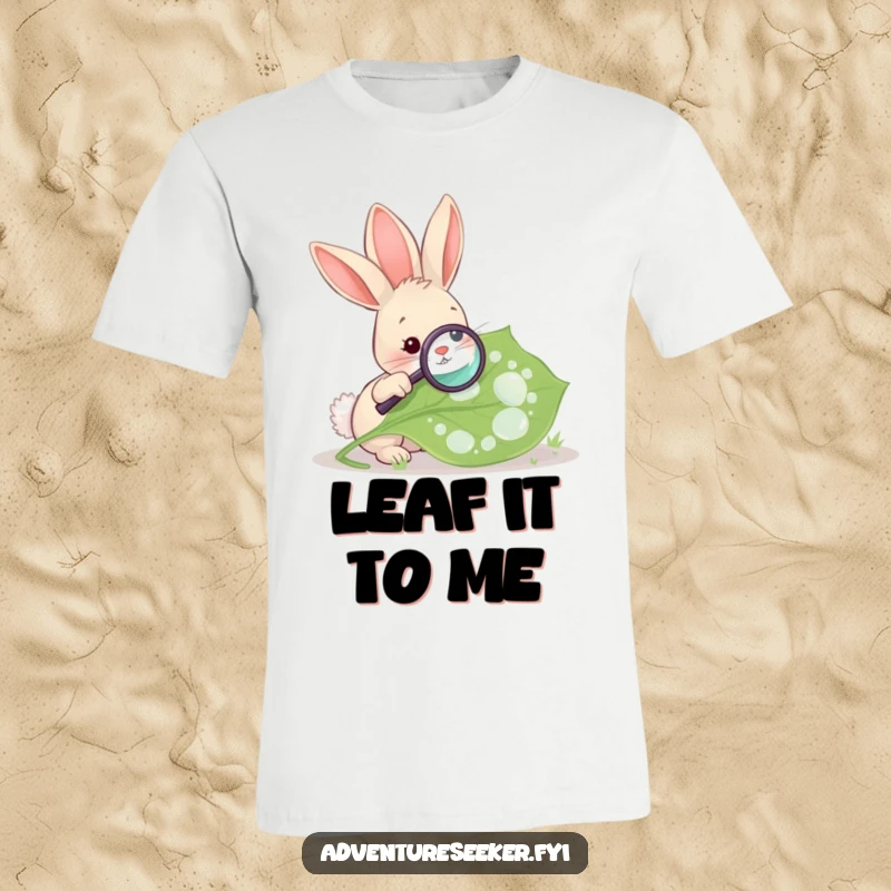 Funny Rabbit Magnifying Leaf T-Shirt. A curious rabbit is engrossed in studying a giant, dew-covered leaf with a magnifying glass.