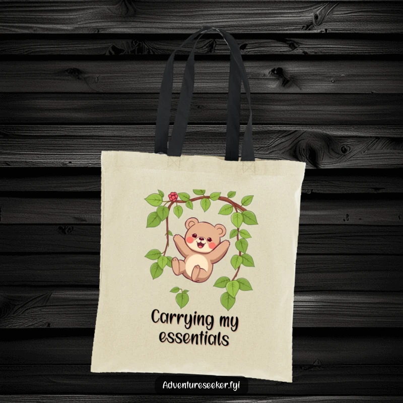 Funny tote bag featuring a small bear character joyfully swinging on a vine, perfect for carrying essentials with a smile.